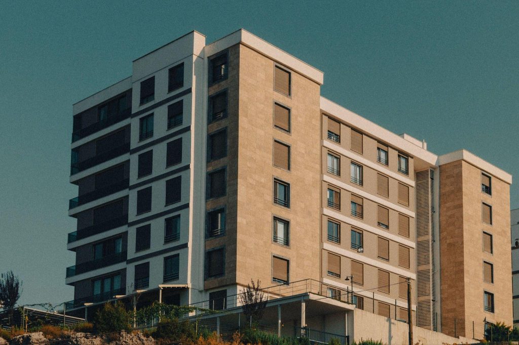 Exterior of a modern Whitby retirement residences community building at dusk.