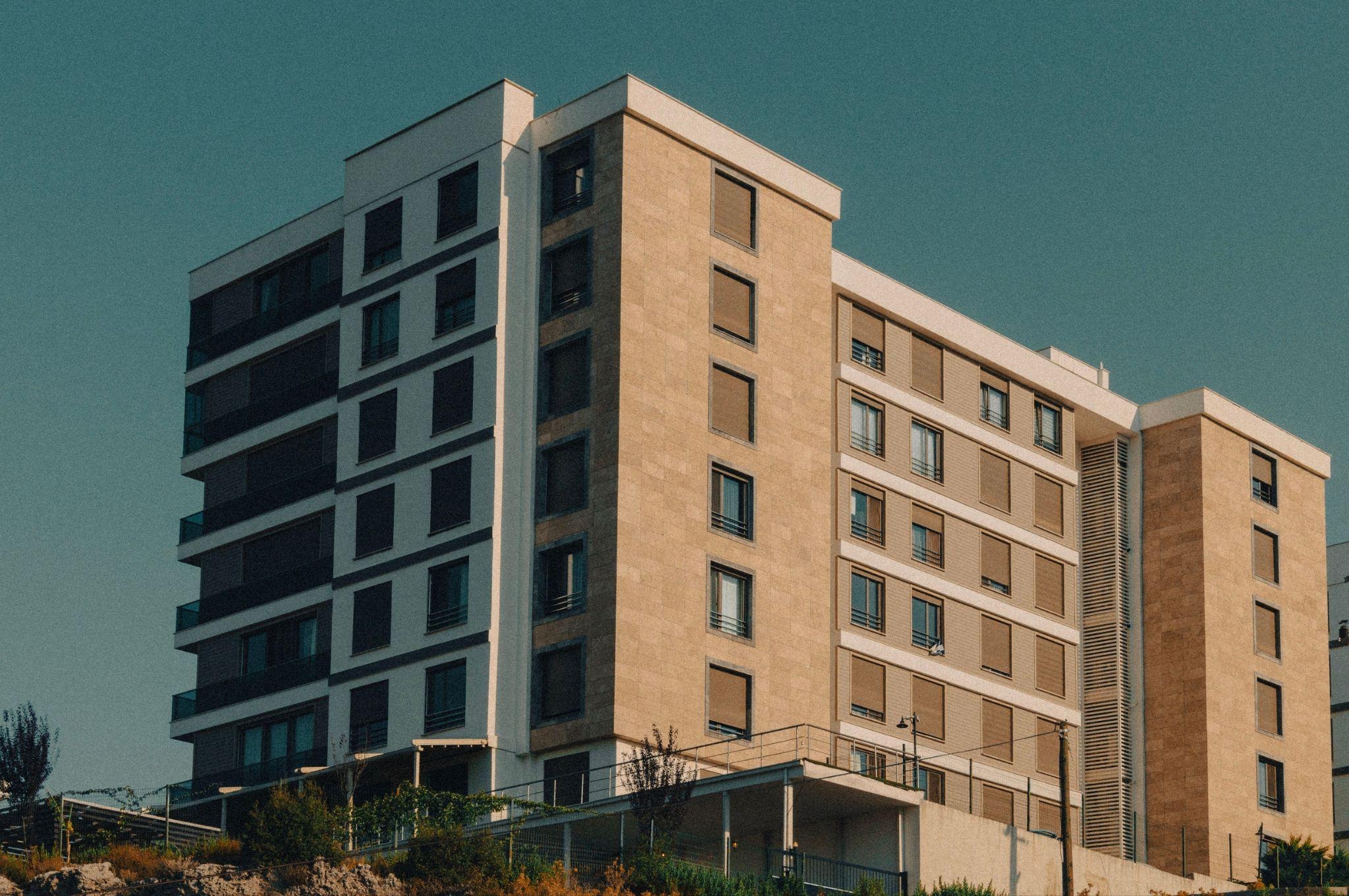 Exterior of a modern Whitby retirement residences community building at dusk.